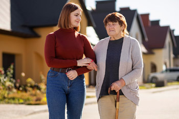 Carer assisting a senior resident